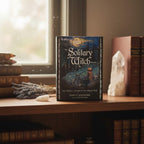 The Witches' Quest The Solitary Witch Oracle deck box featuring ethereal moonlit forest artwork on a wooden shelf.