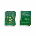 The Witches' Quest spell deck cards featuring green botanical illustrations and gold text for money and fear spells.