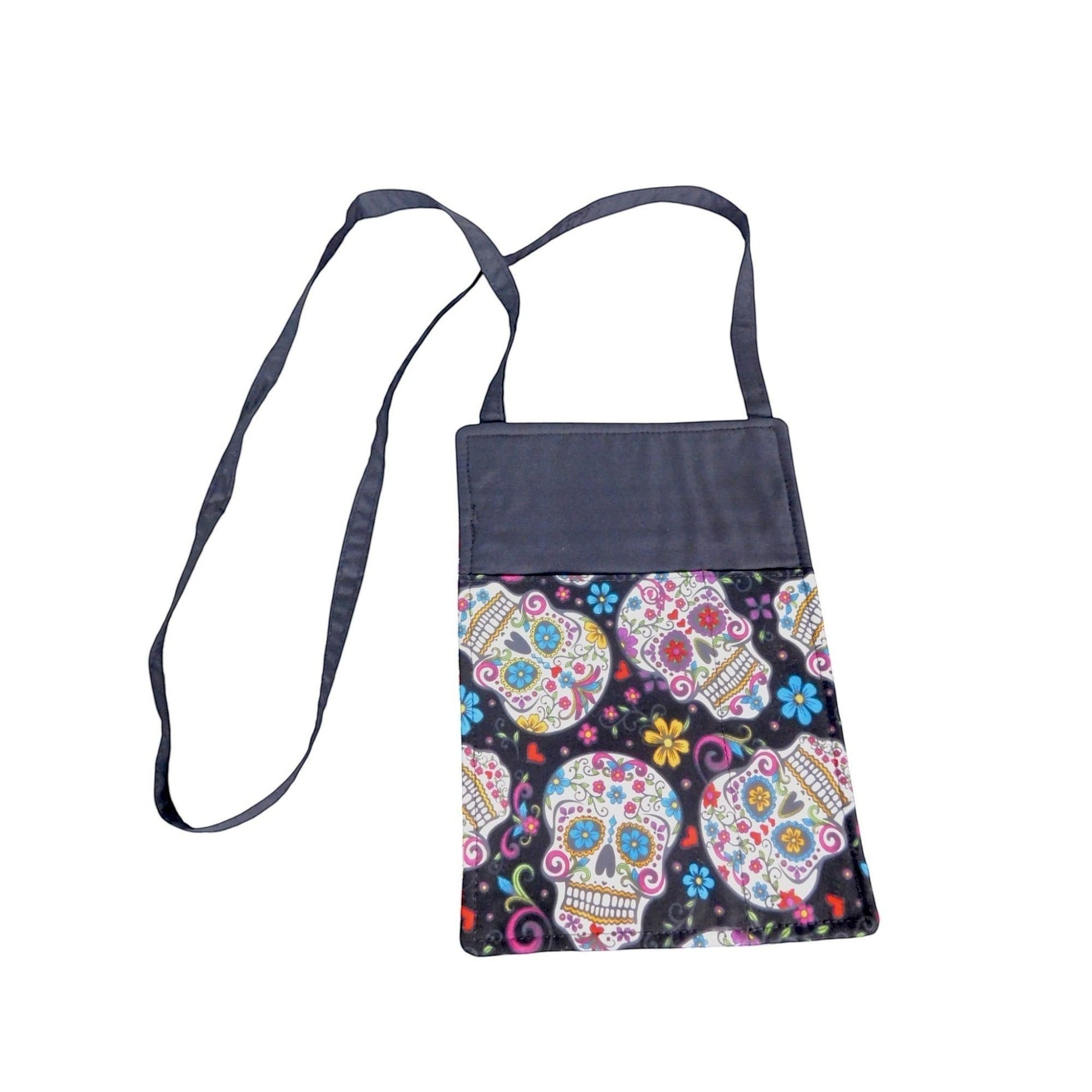 The Witches' Quest handcrafted crossbody bag featuring a vibrant, colorful sugar skull print on a black background.