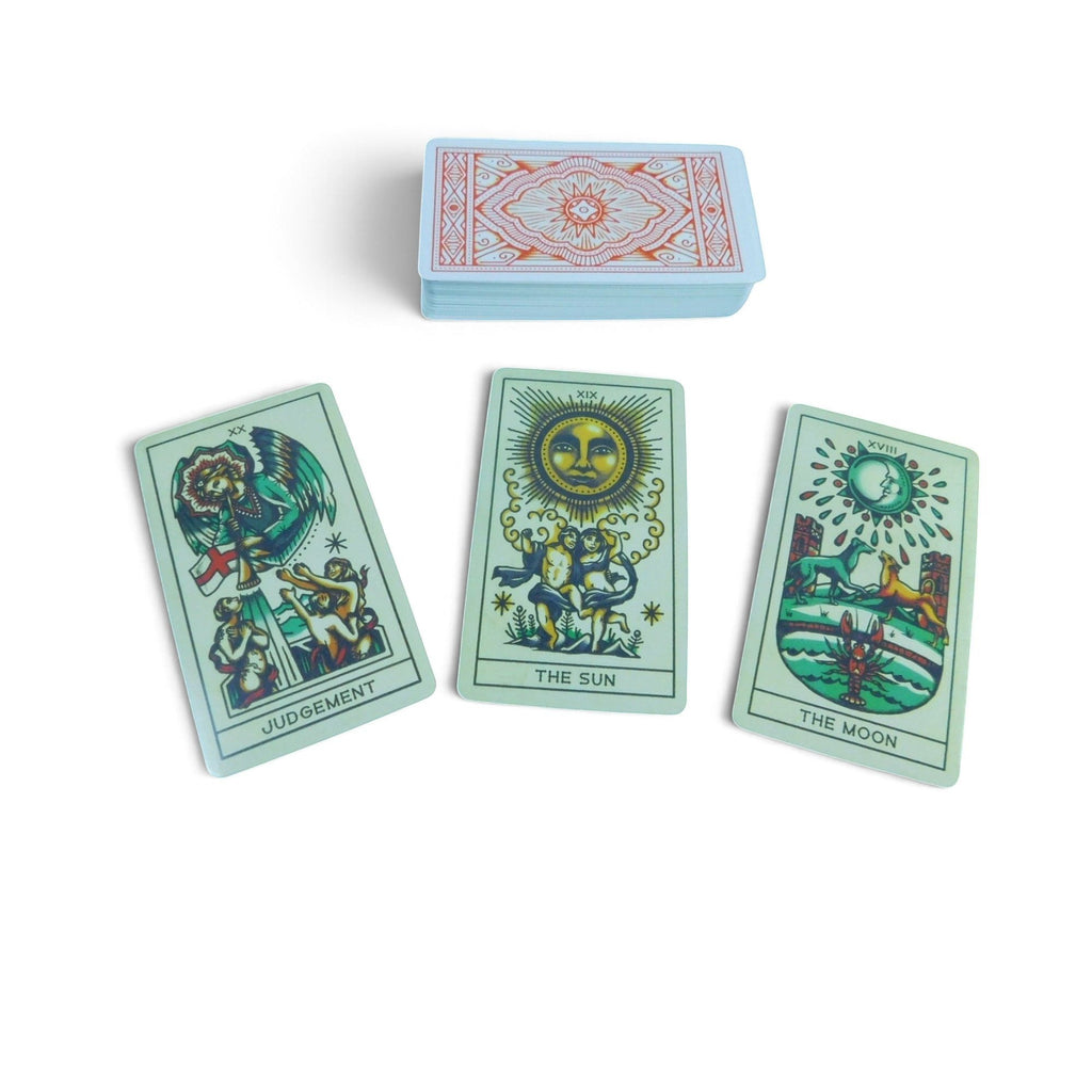 The Witches' Quest Tattoo Tarot deck featuring Judgement, The Sun, and The Moon cards with vintage tattoo art style.