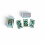 The Witches' Quest Tattoo Tarot deck featuring 78 illustrated cards with mystical tattoo-style artwork.