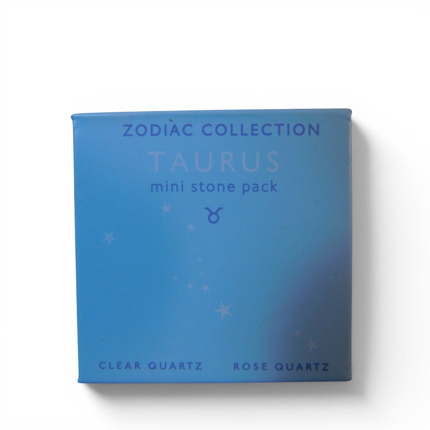 The Witches' Quest Taurus Zodiac Collection mini stone pack box featuring Clear Quartz and Rose Quartz crystals.