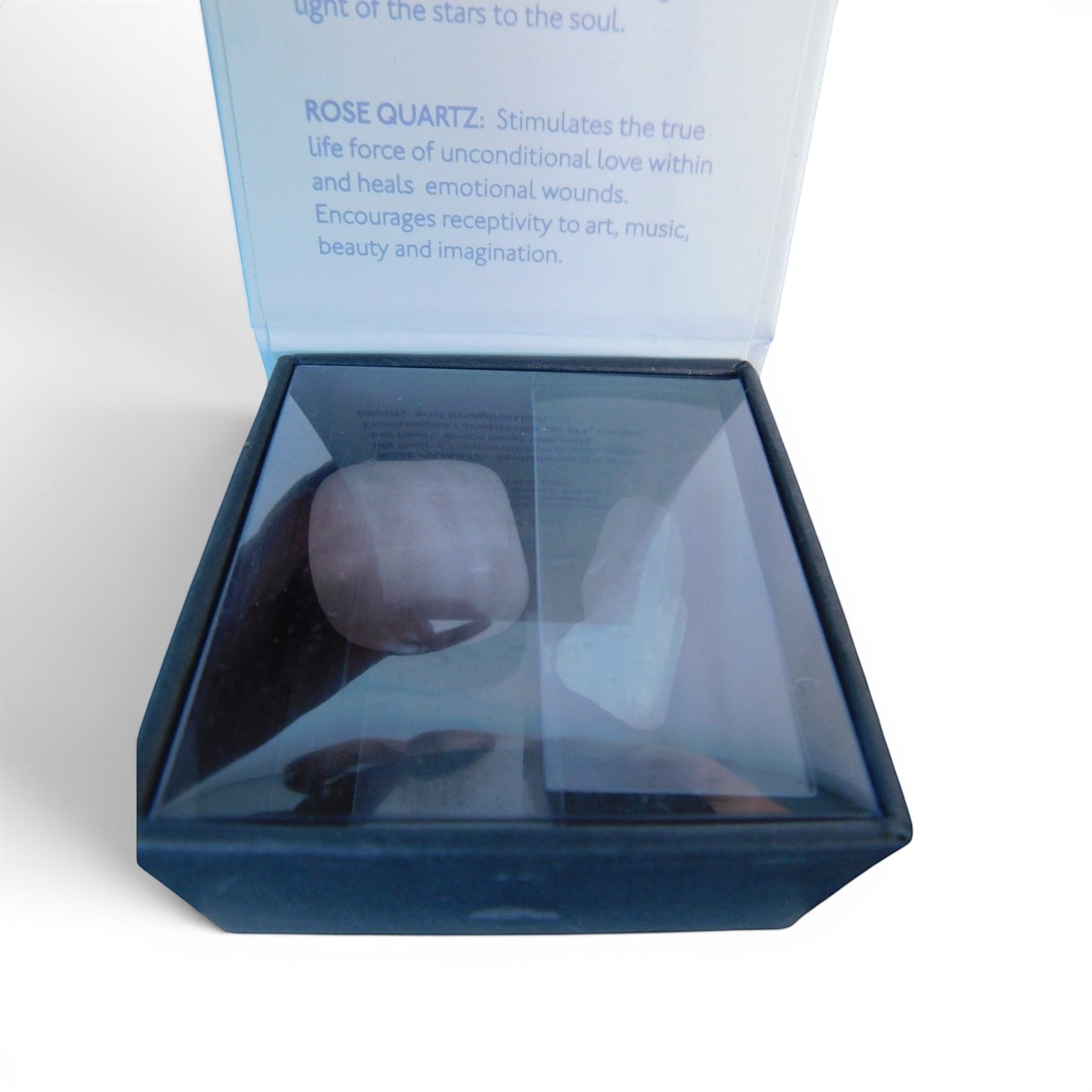 The Witches' Quest Taurus zodiac crystal gift set featuring rose quartz and clear quartz stones in a display box.