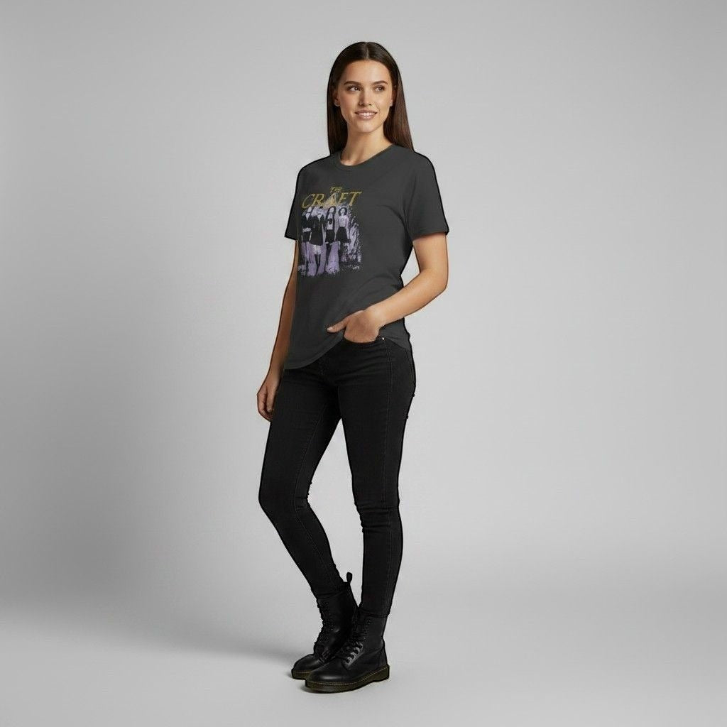 The Witches' Quest charcoal crew neck t-shirt with The Craft movie graphic print worn by a woman with black jeans.