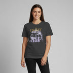 The Witches' Quest charcoal crew neck t-shirt featuring The Craft movie graphic print worn by a smiling woman.