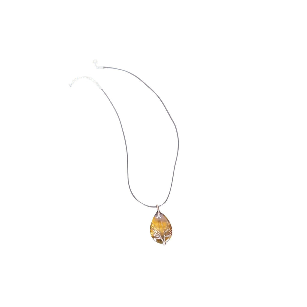 The Witches' Quest teardrop Tiger's Eye pendant with a silver wire wrapped Tree of Life design on a cord necklace.