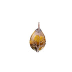 The Witches' Quest teardrop Tiger's Eye pendant with intricate wire-wrapped Tree of Life design in golden-brown stone.