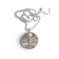 The Witches' Quest silver-tone Tree of Life pendant necklace with a 1.4-inch round charm and 23.5-inch box chain.