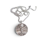 The Witches' Quest silver-tone Tree of Life pendant necklace with a 1.4-inch round charm and 23.5-inch box chain.