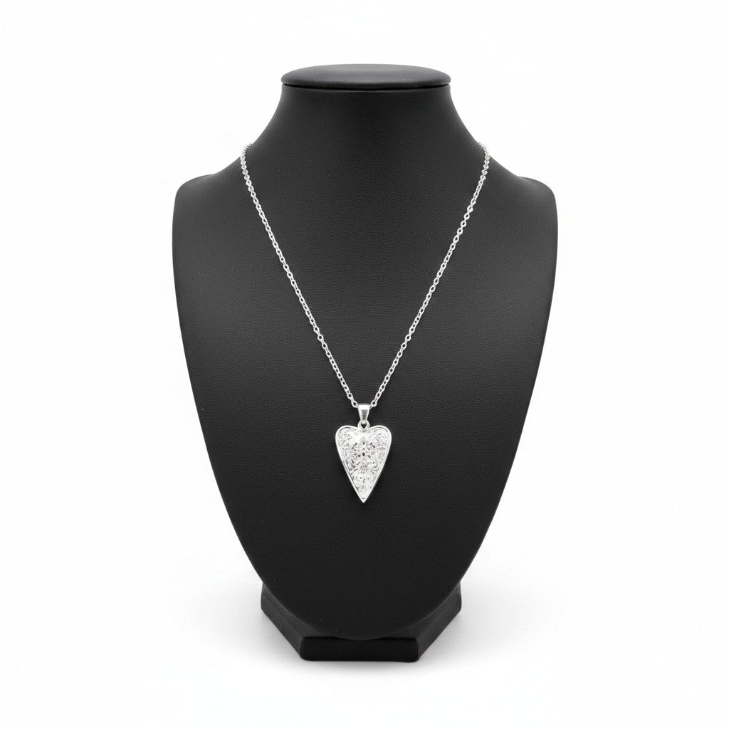 The Witches' Quest silver tone heart pendant necklace featuring a Triple Moon goddess relief on a delicate cable chain.