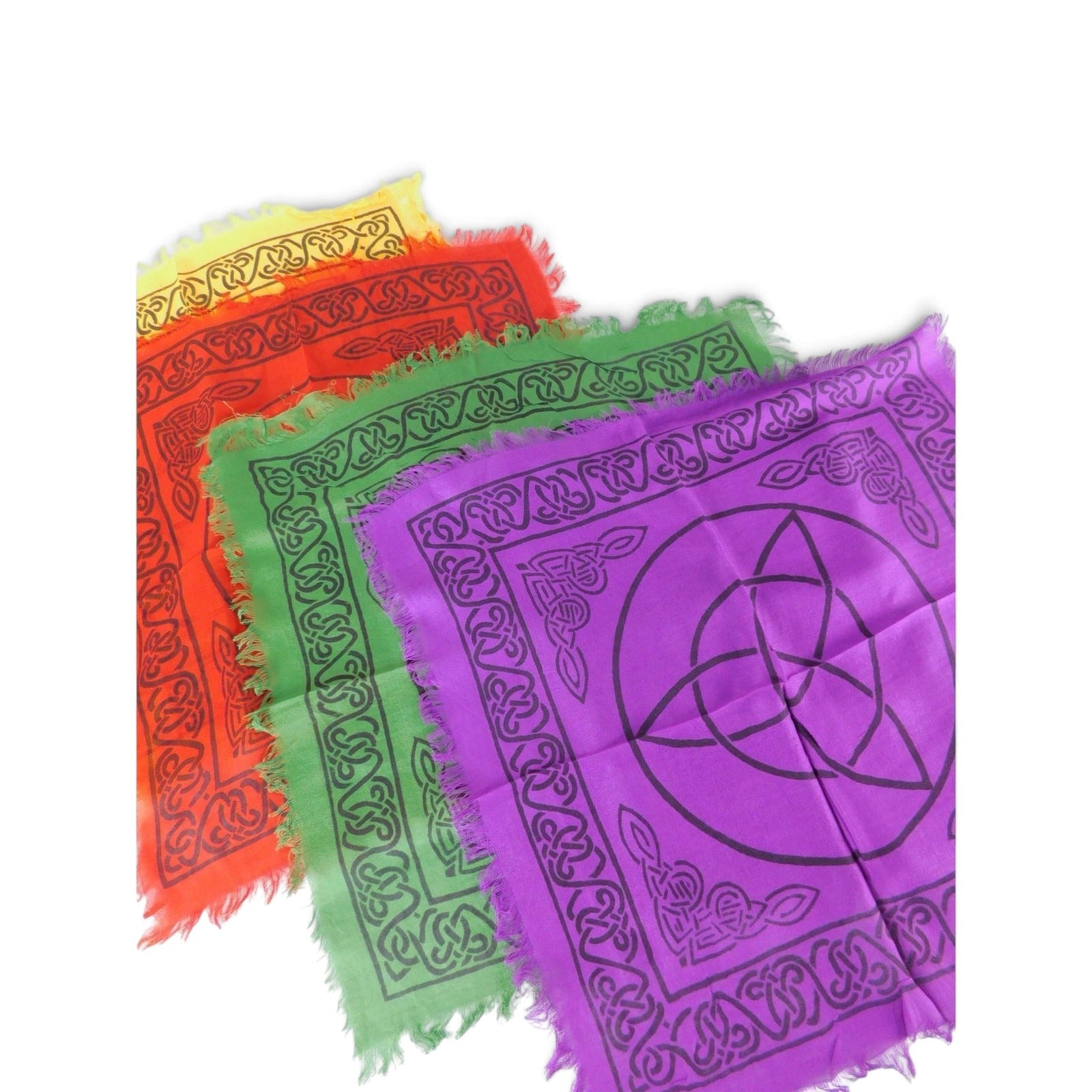 The Witches' Quest set of four rainbow-colored altar cloths with black triquetra and Celtic knot prints and fringe edges.