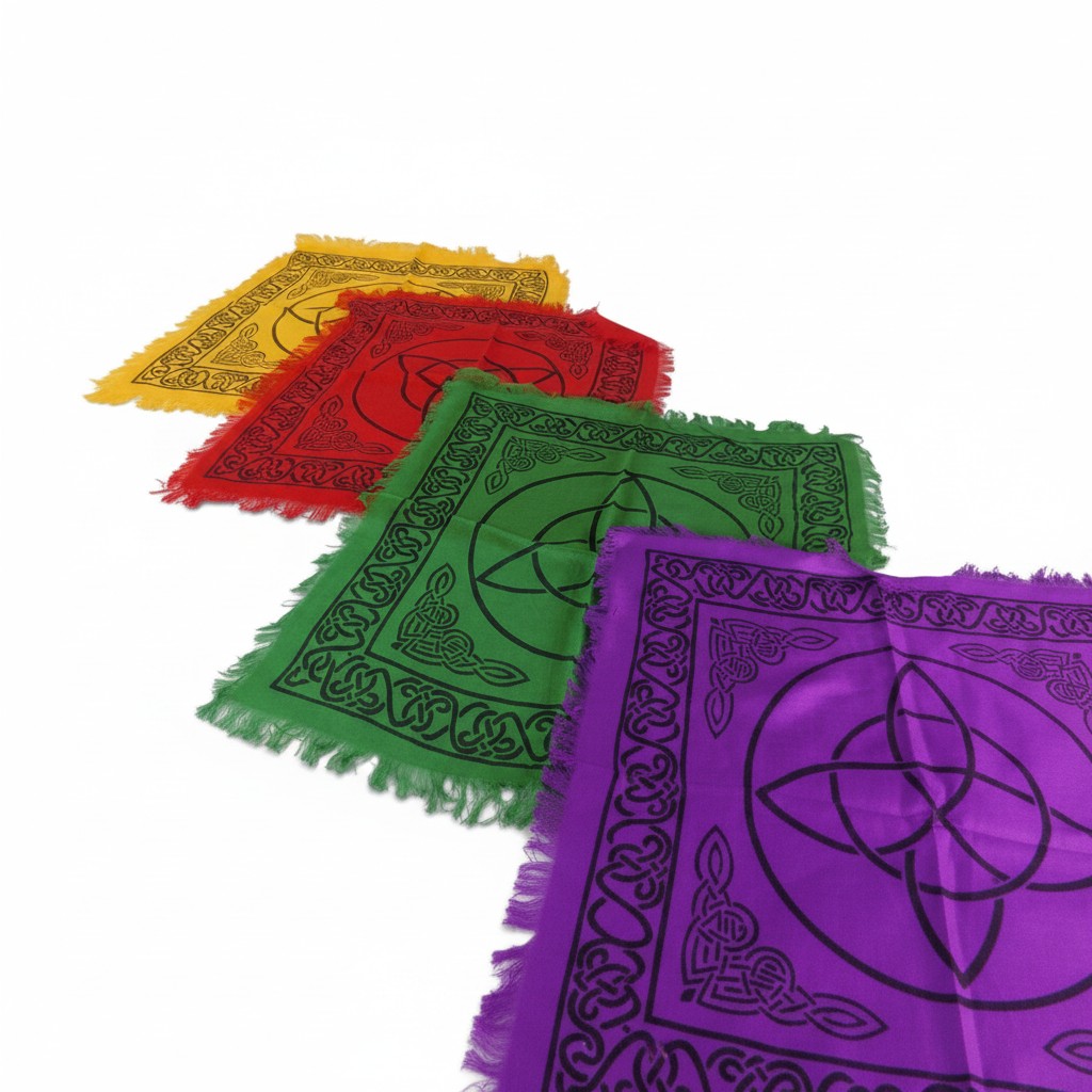 The Witches' Quest set of 4 rainbow altar cloths with black triquetra and Celtic knot prints and fringed edges.