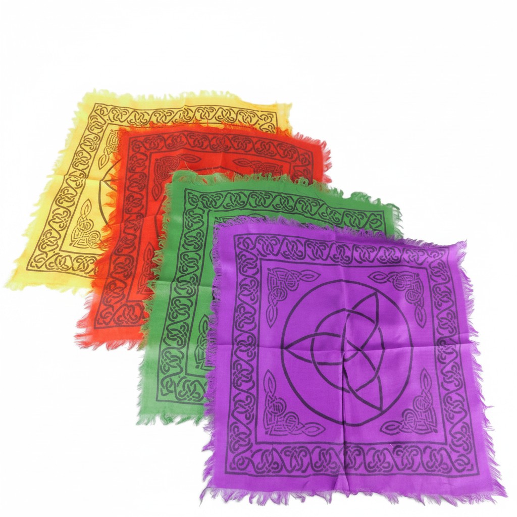 The Witches' Quest set of 4 rainbow altar cloths with black Triquetra and Celtic knot prints and fringed edges.
