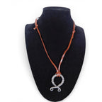 The Witches' Quest Norse Viking necklace with a twisted silver tone oval pendant on a brown leather cord.
