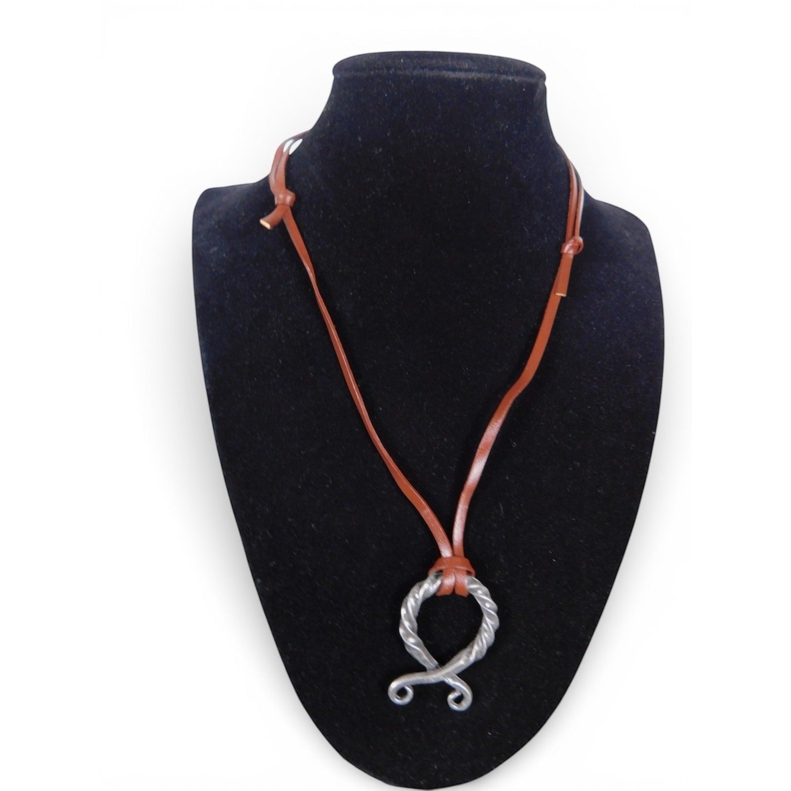 The Witches' Quest Norse Viking necklace with a twisted silver tone oval pendant on a brown leather cord.