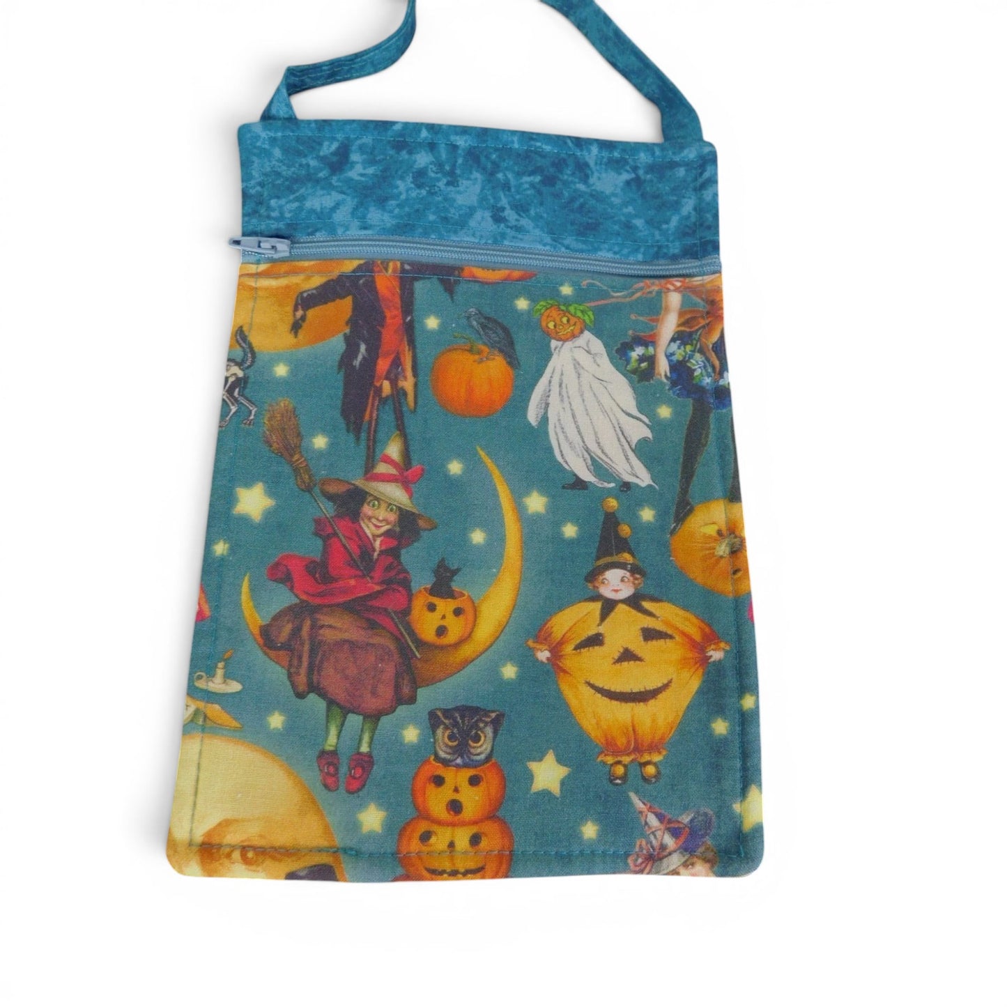 The Witches' Quest handmade Halloween crossbody bag with vintage witch and pumpkin print on a teal fabric background.