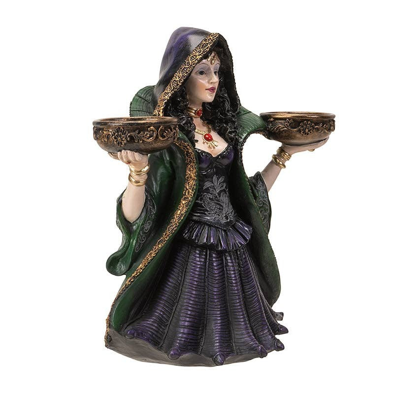 The Witches' Quest witch candle holder statue featuring a sorceress in a green and purple gown holding two bowls.