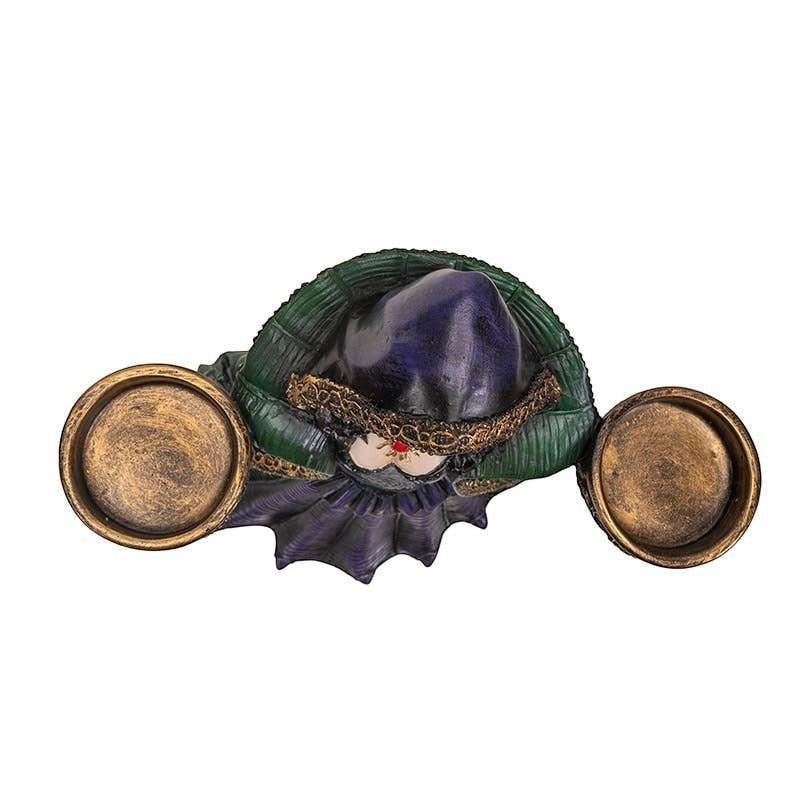 The Witches' Quest enchanted witch candle holder statue in green and purple robes with two gold tea light bowls