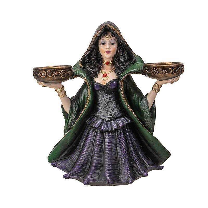 The Witches' Quest witch statue candle holder in a green and purple gown holding two ornate tea light bowls.