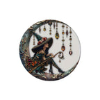 The Witches' Quest decorative witch sitting on a crescent moon wall ornament with jewel-toned dangling accents.