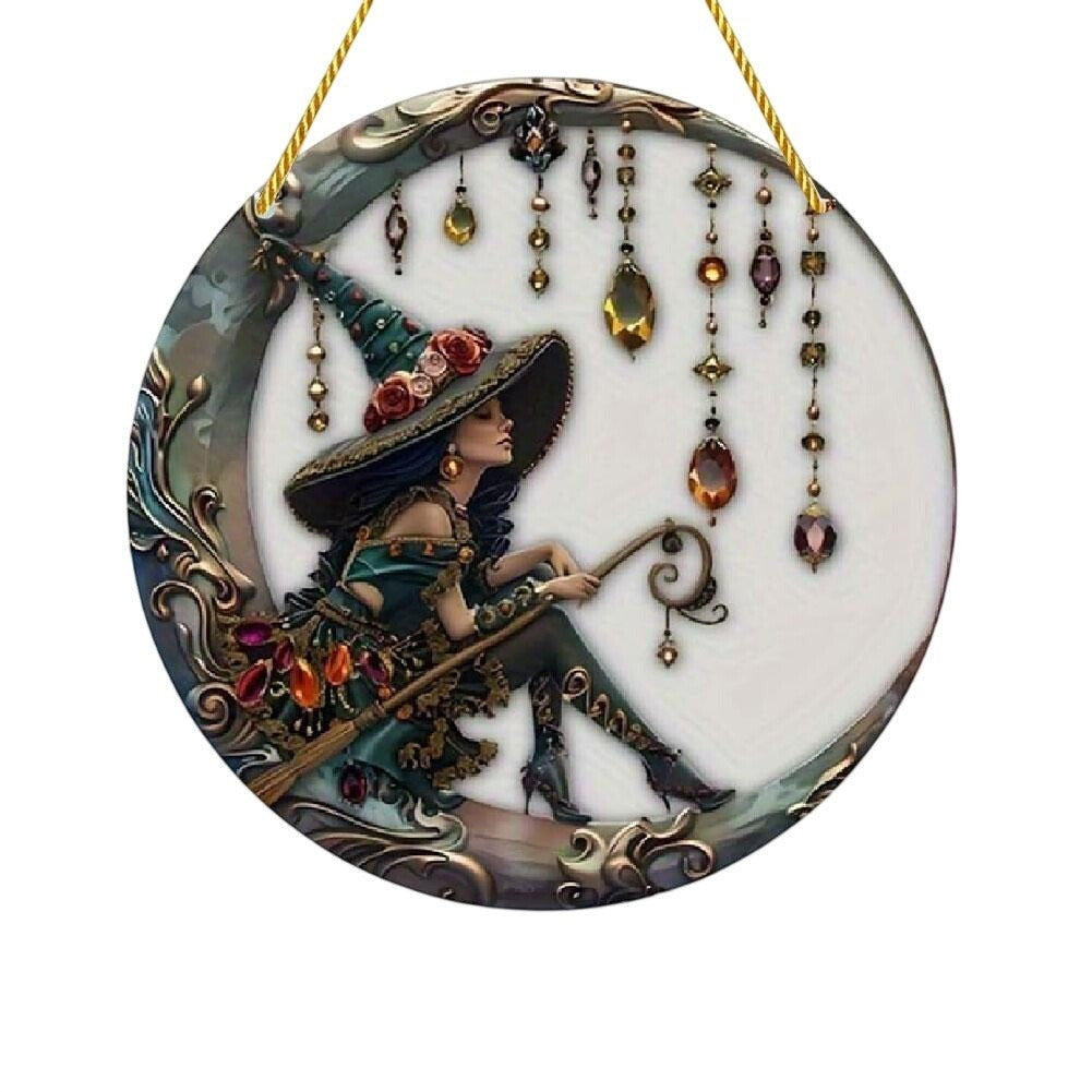 The Witches' Quest decorative wall hanging featuring a witch in a floral hat sitting on a crescent moon with jewels.