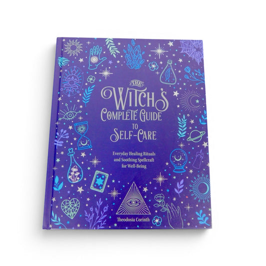 The Witches' Quest The Witch's Complete Guide to Self-Care hardcover book with purple cover and mystical illustrations.