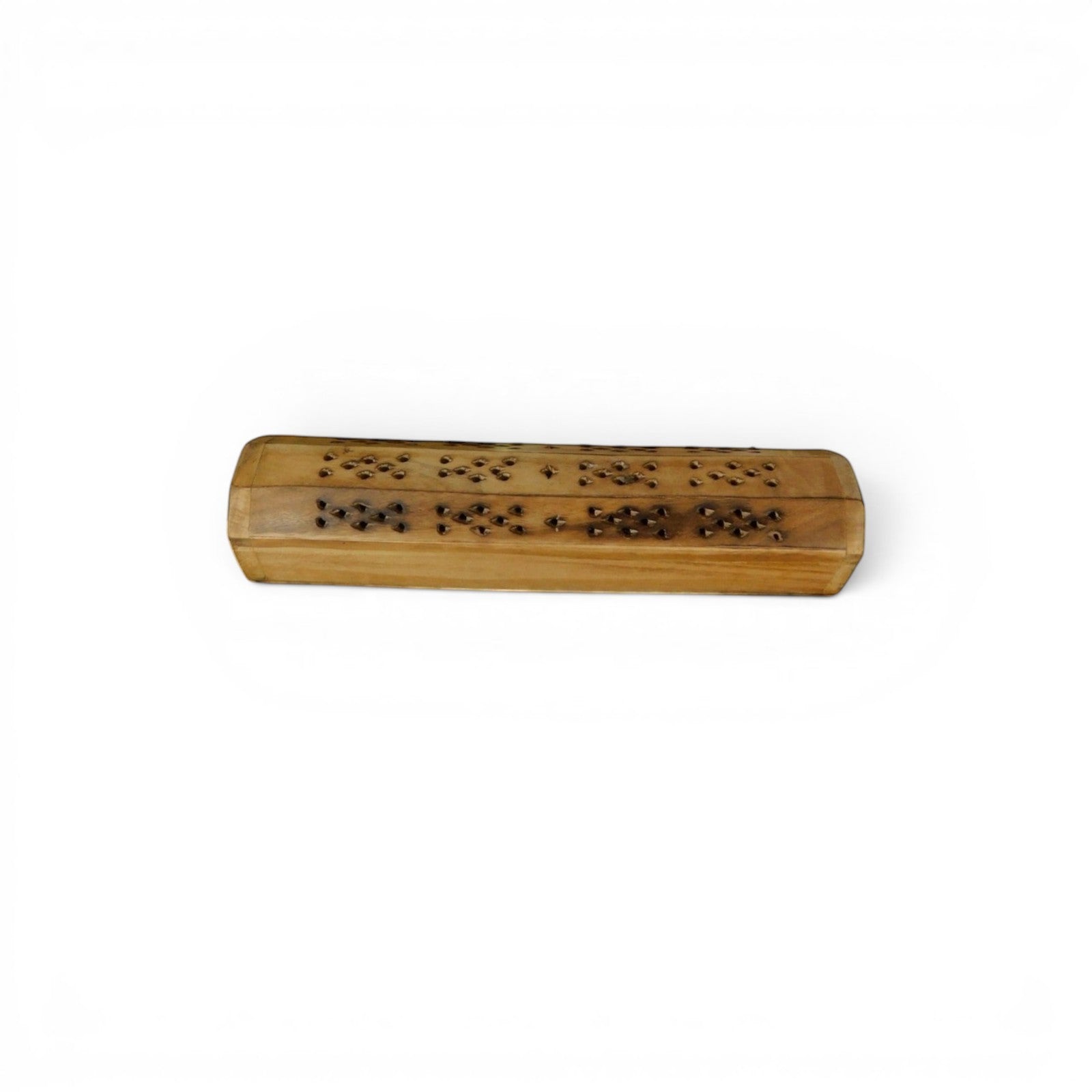 The Witches' Quest handcrafted wooden incense burner box with floral cutouts for smoke diffusion on a light table.