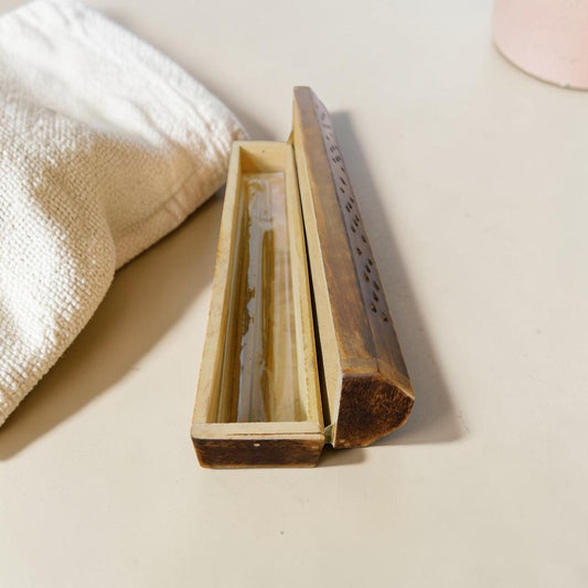 The Witches' Quest rustic wooden incense burner box with hinged lid for sticks and cones on a neutral surface.