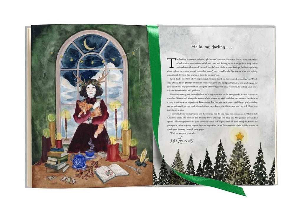 The Witches' Quest Seasons of the Witch Yule Journal open to an illustrated page with a green ribbon bookmark.