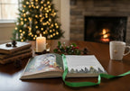 The Witches' Quest Seasons of the Witch Yule Journal open on a wooden table with a candle, holly, and Christmas tree.