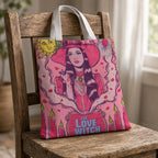 Love Witch tote bag with witch illustration on a wooden chair